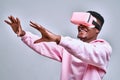 Young african american man playing virtual reality game using goggles Royalty Free Stock Photo