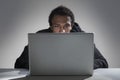 Young African American man reading from laptop Royalty Free Stock Photo