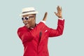 Young African American man red entertainment suit yelling and clapping hands performing dance Royalty Free Stock Photo