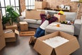 Young african american man relaxed with hands on head sitting on floor at new home Royalty Free Stock Photo