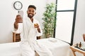 Young african american man relaxed making selfie by the smartphone drinking champagne at beauty center Royalty Free Stock Photo