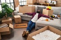 Young african american man relaxed sitting on floor at new home Royalty Free Stock Photo