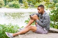 Young African American Man relaxing at Central Park in New York Royalty Free Stock Photo