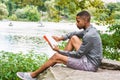 Young African American Man relaxing at Central Park in New York Royalty Free Stock Photo