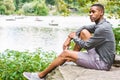 Young African American Man relaxing at Central Park in New York Royalty Free Stock Photo