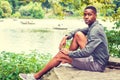 Young African American Man relaxing at Central Park in New York Royalty Free Stock Photo