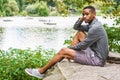 Young African American Man relaxing at Central Park in New York Royalty Free Stock Photo