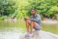 Young African American Man relaxing at Central Park in New York Royalty Free Stock Photo