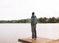 Young African American Man relaxing at Park near lake. Royalty Free Stock Photo