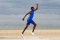 Young african american man running at beach Royalty Free Stock Photo