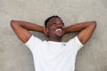 Young african american man smiling with hands behind head Royalty Free Stock Photo