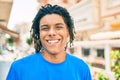 Young african american man smiling happy looking to the camera at street of city Royalty Free Stock Photo