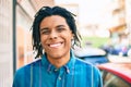 Young african american man smiling happy looking to the camera at street of city Royalty Free Stock Photo