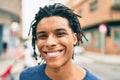 Young african american man smiling happy looking to the camera at street of city Royalty Free Stock Photo
