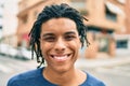 Young african american man smiling happy looking to the camera at street of city Royalty Free Stock Photo