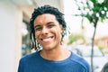 Young african american man smiling happy looking to the camera at street of city Royalty Free Stock Photo