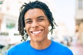 Young african american man smiling happy looking to the camera at street of city Royalty Free Stock Photo