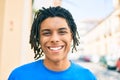 Young african american man smiling happy looking to the camera at street of city Royalty Free Stock Photo