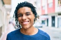 Young african american man smiling happy looking to the camera at street of city Royalty Free Stock Photo