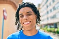 Young african american man smiling happy looking to the camera at street of city Royalty Free Stock Photo