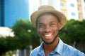 Young african american man smiling with hat Royalty Free Stock Photo