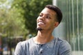 Young african american man smiling outside Royalty Free Stock Photo