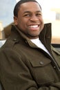 Young African American man smiling outside. Royalty Free Stock Photo