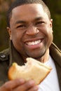 Young African American man smiling outside. Royalty Free Stock Photo