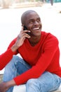 Young african american man smiling talking on mobile. Royalty Free Stock Photo