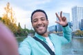 Young African American man taking a selfie looking at camera smiling - Tourist student Royalty Free Stock Photo