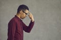 Young african american man thinking put finger to forehead studio portrait Royalty Free Stock Photo