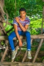 Young African American Man traveling, relaxing at Central Park, Royalty Free Stock Photo