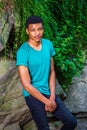 Young African American Man traveling, relaxing at Central Park, Royalty Free Stock Photo