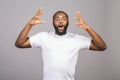 Young african american man very happy and excited, winner expression celebrating victory screaming with big smile and raised hands Royalty Free Stock Photo