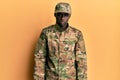 Young african american man wearing army uniform depressed and worry for distress, crying angry and afraid Royalty Free Stock Photo