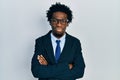 Young african american man wearing business suit skeptic and nervous, disapproving expression on face with crossed arms Royalty Free Stock Photo