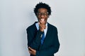 Young african american man wearing business suit and tie smiling and laughing hard out loud because funny crazy joke Royalty Free Stock Photo