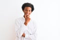 Young african american man wearing elegant shirt standing over  white background looking confident at the camera smiling Royalty Free Stock Photo