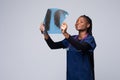 Young African American Nurse Holding A Chest X-Ray