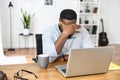 Young African-American office worker feeling tired