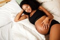 Young African American pregnant woman relaxing