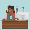 Young female african-american dj working on radio.