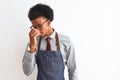 Young african american shopkeeper man wearing apron glasses over  white background tired rubbing nose and eyes feeling Royalty Free Stock Photo