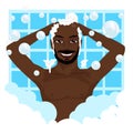 Young african american smiling man washing his hair with shampoo Royalty Free Stock Photo