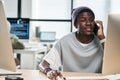 Young African American software developer consulting client on mobile phone Royalty Free Stock Photo