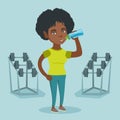 Young african-american sportswoman drinking water. Royalty Free Stock Photo