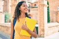 Young african american student girl smiling happy holding book at university campus Royalty Free Stock Photo