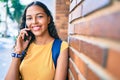 Young african american student girl smiling happy talking on the smartphone at university campus Royalty Free Stock Photo