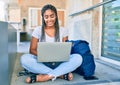 Young african american student woman smiling happy using computer laptop at the university campus Royalty Free Stock Photo