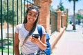 Young african american student woman smiling happy using smartphone at the university campus Royalty Free Stock Photo